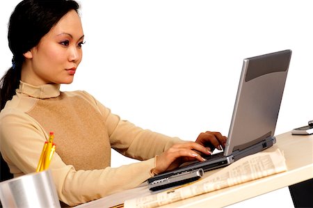 simsearch:625-01097695,k - Side profile of a businesswoman using a laptop Foto de stock - Royalty Free Premium, Número: 625-00836382
