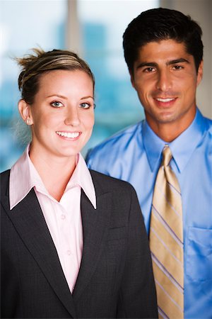 simsearch:625-00851478,k - Portrait of a businessman and a businesswoman smiling Stock Photo - Premium Royalty-Free, Code: 625-00837841