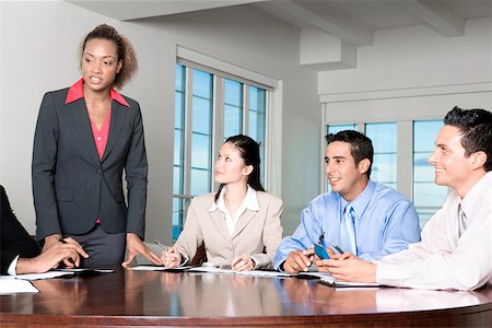 Two businessmen and two businesswomen in a meeting Stock Photo - Premium Royalty-Free, Code: 625-00837870