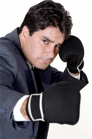 Portrait of a businessman wearing boxing gloves Stock Photo - Premium Royalty-Free, Code: 625-00837932