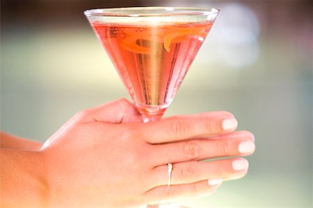 simsearch:625-01262374,k - Close-up of a woman's hand holding a glass of martini Stock Photo - Premium Royalty-Free, Code: 625-00837964