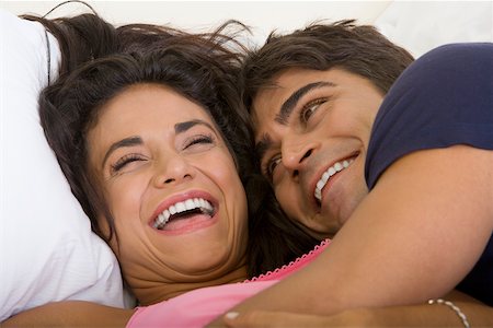 simsearch:625-01092667,k - Close-up of a young couple lying on the bed Foto de stock - Sin royalties Premium, Código: 625-00838235