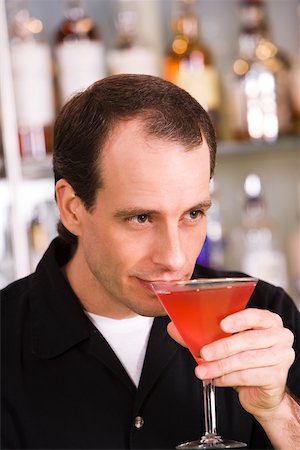 simsearch:625-01262374,k - Close-up of a mid adult man drinking a cocktail Stock Photo - Premium Royalty-Free, Code: 625-00838367