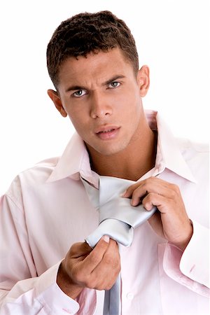 simsearch:625-00841323,k - Portrait of a young man putting on a tie Stock Photo - Premium Royalty-Free, Code: 625-00838492