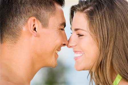 rubbing noses together - Side profile of a young couple rubbing their noses Stock Photo - Premium Royalty-Free, Code: 625-00838519