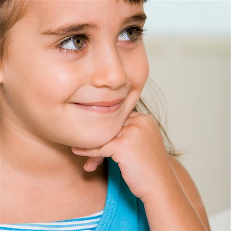 Close-up of a girl smiling Stock Photo - Premium Royalty-Free, Code: 625-00838554