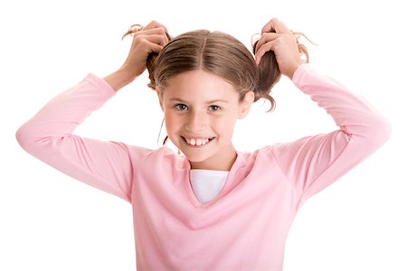 Portrait of a girl pulling her pigtails Stock Photo - Premium Royalty-Free, Code: 625-00838582