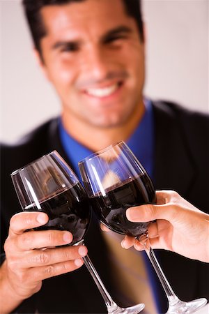 executive and toast - Close-up of two people toasting with wineglasses Stock Photo - Premium Royalty-Free, Code: 625-00838942