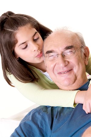 simsearch:625-01746794,k - Close-up of a granddaughter hugging her grandfather from behind Foto de stock - Royalty Free Premium, Número: 625-00839267