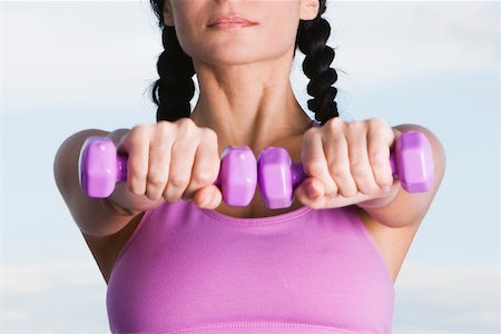 simsearch:625-00901737,k - Close-up of a young woman holding dumbbells Stock Photo - Premium Royalty-Free, Code: 625-00839297