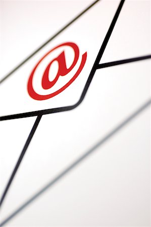 simsearch:700-00184686,k - Close-up of an 'at' symbol on an envelope Foto de stock - Sin royalties Premium, Código: 625-00839932