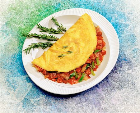 Close-up of a stuffed omelet in a plate Stock Photo - Premium Royalty-Free, Code: 625-00849035