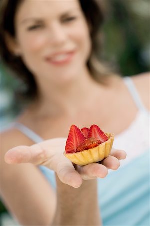 simsearch:625-00898908,k - Close-up of a cupcake on a young woman's hand Stock Photo - Premium Royalty-Free, Code: 625-00849081
