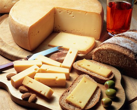 High angle view of cheese with bread and olives Stock Photo - Premium Royalty-Free, Code: 625-00849113