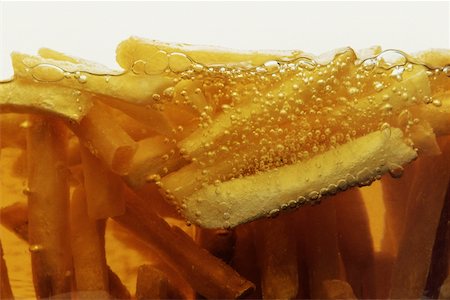 simsearch:625-00849512,k - Nahaufnahme der Pommes frites Frittieren in Öl Stockbilder - Premium RF Lizenzfrei, Bildnummer: 625-00849432