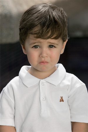 sad young boy - Portrait of a boy looking sad Stock Photo - Premium Royalty-Free, Code: 625-00849495