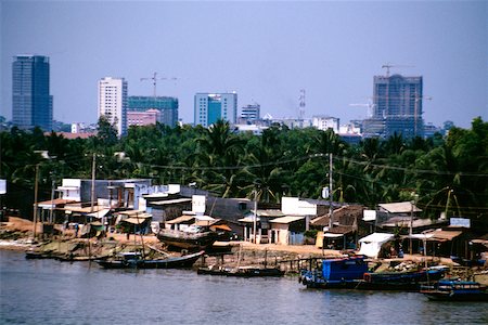 Saigon River contrasts with hi- rises in background, Vietnam Stock Photo - Premium Royalty-Free, Code: 625-00840718