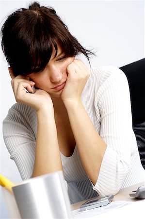 phone young woman upset - Close-up of a businesswoman looking pensive Stock Photo - Premium Royalty-Free, Code: 625-00840903