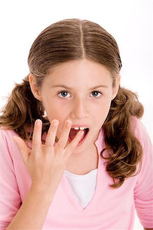 preteens fingering - Portrait of a girl with her finger in her mouth Stock Photo - Premium Royalty-Free, Code: 625-00841187