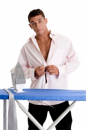 simsearch:625-00841323,k - Portrait of a young man buttoning his shirt Stock Photo - Premium Royalty-Free, Code: 625-00841319