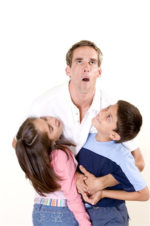 Father lifting his son and daughter Stock Photo - Premium Royalty-Free, Code: 625-00841375