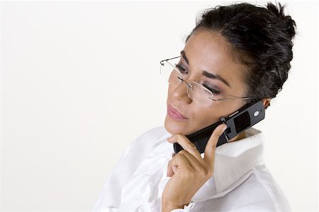 simsearch:625-01261416,k - Close-up of a young woman talking on a mobile phone Foto de stock - Royalty Free Premium, Número: 625-00841398