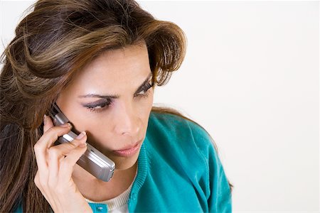 simsearch:625-01097695,k - Close-up of a mid adult woman talking on a mobile phone Foto de stock - Royalty Free Premium, Número: 625-00841406