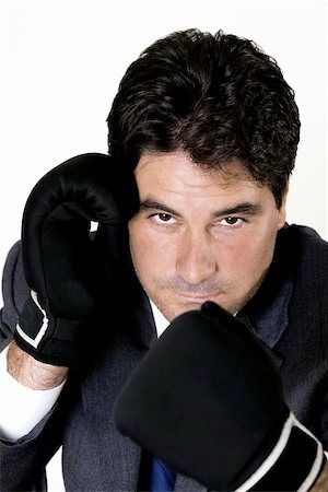 simsearch:625-02933013,k - Portrait of a businessman wearing boxing gloves Foto de stock - Sin royalties Premium, Código: 625-00841470