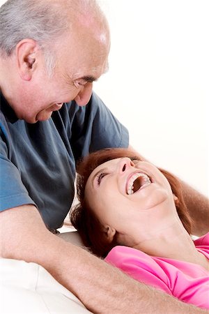 simsearch:625-00841593,k - Close-up of a senior couple laughing and looking at each other Stock Photo - Premium Royalty-Free, Code: 625-00841566