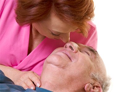 rubbing noses together - Close-up of a senior couple nuzzling Stock Photo - Premium Royalty-Free, Code: 625-00841573