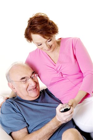 simsearch:625-00841593,k - Close-up of a senior couple looking at a remote control Stock Photo - Premium Royalty-Free, Code: 625-00841588