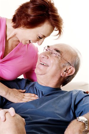 elderly woman seated in armchair - Close-up of a senior couple looking at each other Stock Photo - Premium Royalty-Free, Code: 625-00841595