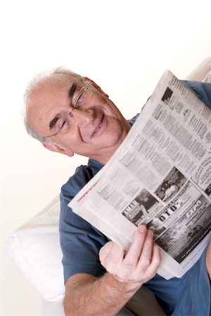 simsearch:625-01093661,k - Close-up of a senior man reading a newspaper Stock Photo - Premium Royalty-Free, Code: 625-00841610