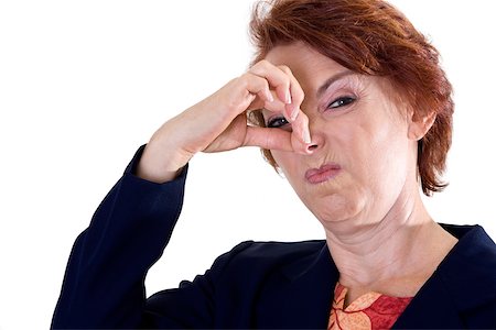 Portrait of a businesswoman holding her nose Stock Photo - Premium Royalty-Free, Code: 625-00841648