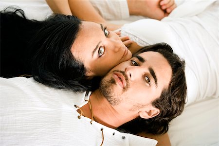 simsearch:625-00842233,k - Portrait of a young couple lying on the bed Foto de stock - Sin royalties Premium, Código: 625-00842344