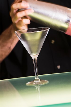 simsearch:6102-03828319,k - Mid section view of a man holding a cocktail shaker Stock Photo - Premium Royalty-Free, Code: 625-00842535