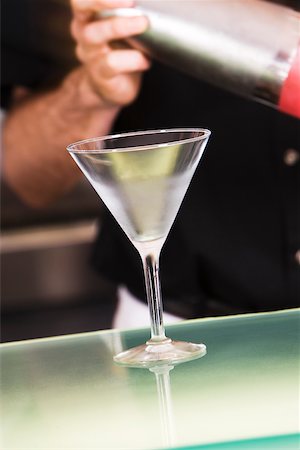 simsearch:6102-03828319,k - Mid section view of a man holding a cocktail shaker Stock Photo - Premium Royalty-Free, Code: 625-00842536