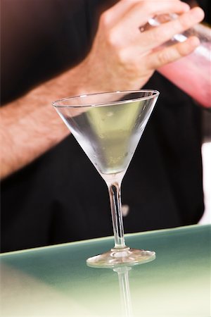 simsearch:6102-03828319,k - Mid section view of a man holding a cocktail shaker Stock Photo - Premium Royalty-Free, Code: 625-00842532