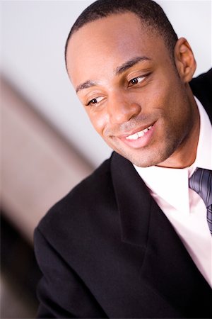 Close-up of a businessman smiling Stock Photo - Premium Royalty-Free, Code: 625-00842677