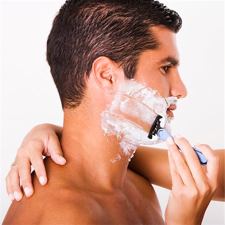 shaving man woman - Close-up of a woman's hand shaving a mid adult man Stock Photo - Premium Royalty-Free, Code: 625-00842724