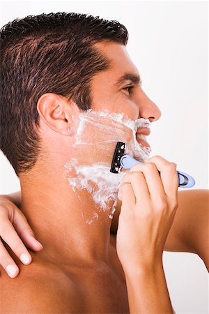 shaving man woman - Close-up of a woman's hand shaving a mid adult man Stock Photo - Premium Royalty-Free, Code: 625-00842721