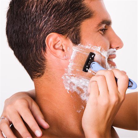 shaving man woman - Close-up of a woman's hand shaving a mid adult man Stock Photo - Premium Royalty-Free, Code: 625-00842722