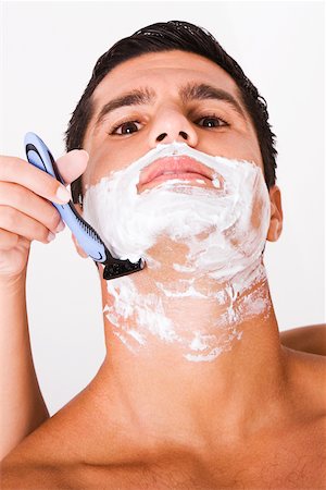 shaving man woman - Close-up of a woman's hand shaving a mid adult man Stock Photo - Premium Royalty-Free, Code: 625-00842731