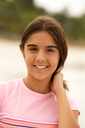 Portrait of a teenage girl smiling Stock Photo - Premium Royalty-Free, Code: 625-00843709