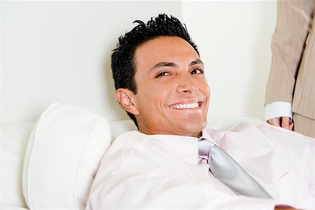 Close-up of a businessman smiling Stock Photo - Premium Royalty-Free, Code: 625-00850154
