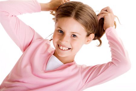 simsearch:614-08872581,k - Portrait of a girl holding her pigtails Fotografie stock - Premium Royalty-Free, Codice: 625-00850161