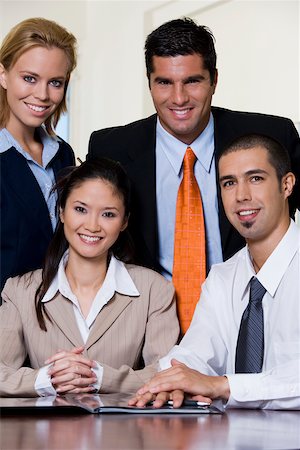 portrait of a group of clerks - Portrait of two businessmen and two businesswomen smiling Stock Photo - Premium Royalty-Free, Code: 625-00850227