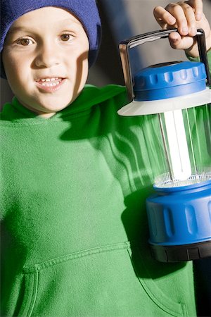Portrait of a boy holding a lantern Stock Photo - Premium Royalty-Free, Code: 625-00850223