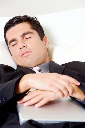 simsearch:640-01357111,k - Businessman sleeping with a laptop Foto de stock - Sin royalties Premium, Código: 625-00850331
