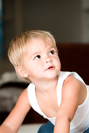 Close-up of a boy crawling on the floor Stock Photo - Premium Royalty-Free, Code: 625-00850398